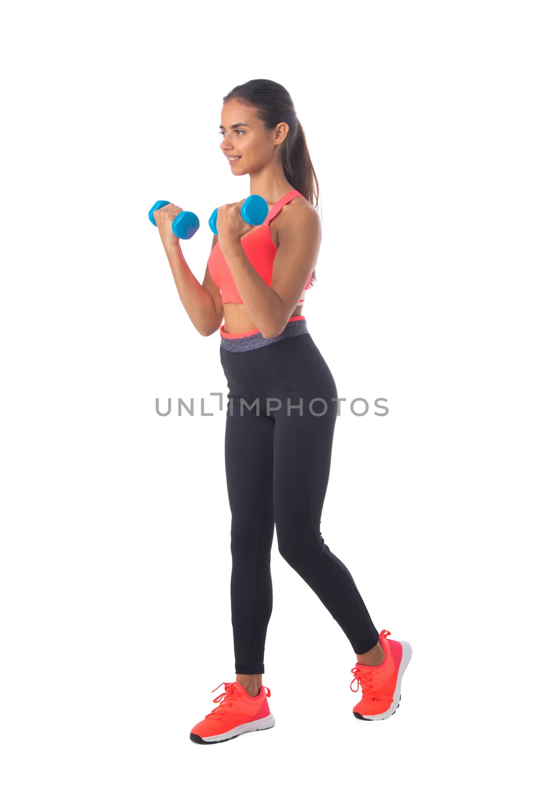 Healthy hispanic fitness girl with dumbbells working out isolated on white background