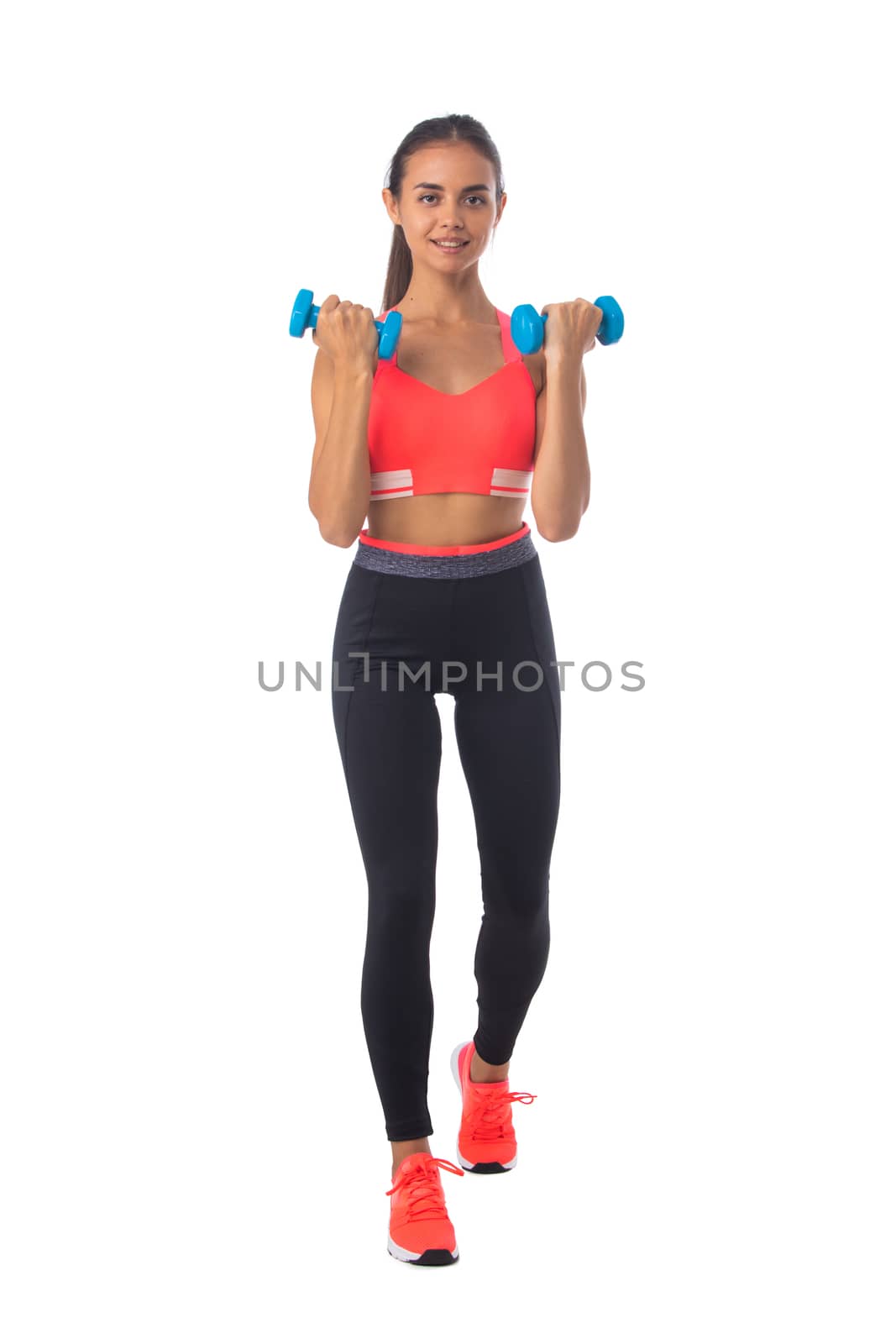 Healthy hispanic fitness girl with dumbbells working out isolated on white background