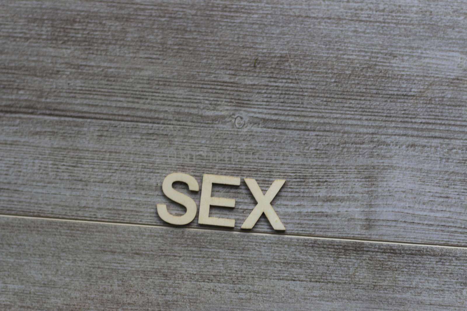 the word sex wrote out on a tile background. High quality photo