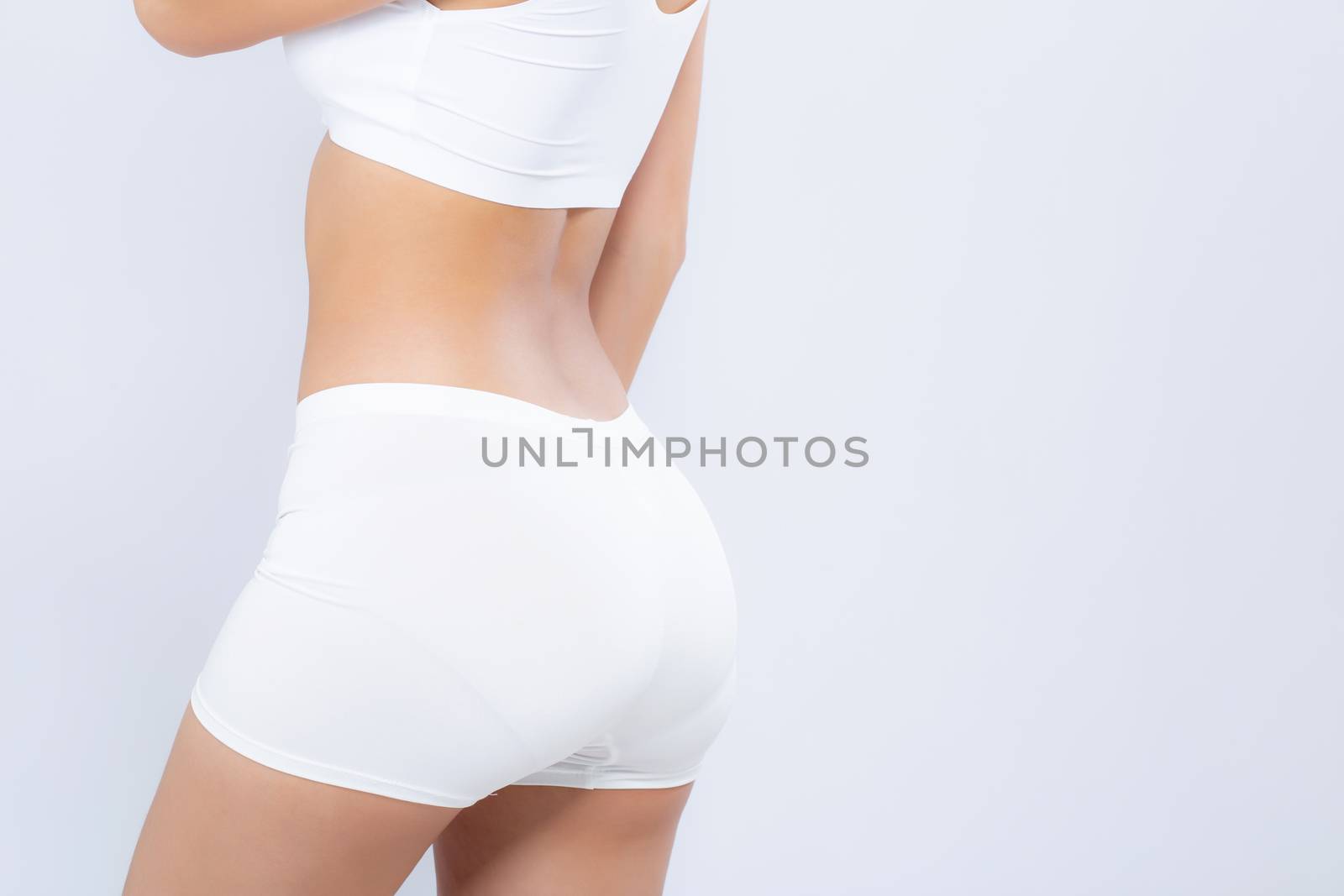 Closeup bottom ass young asian woman beautiful body diet with fit isolated on white background, butt model girl weight slim with health and wellness, weightloss concept.