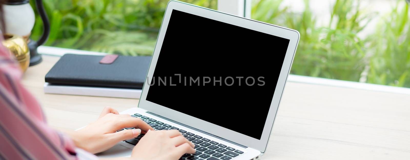 Closeup banner website hand asian young woman working online on  by nnudoo