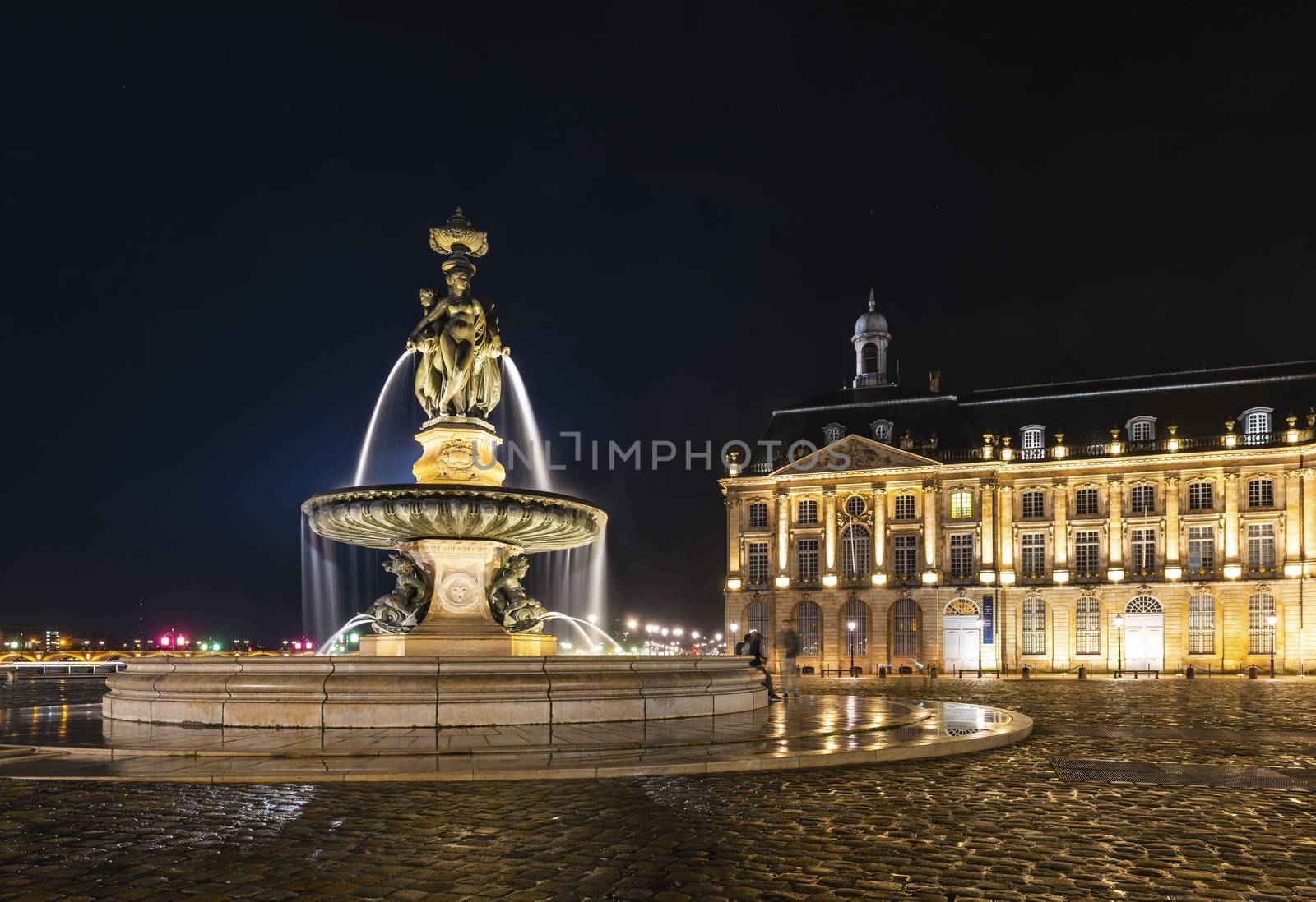 Fountain of three graces on the Place de la Bourse in Bordeaux at night in Gironde, New Aquitaine, France. by Frederic