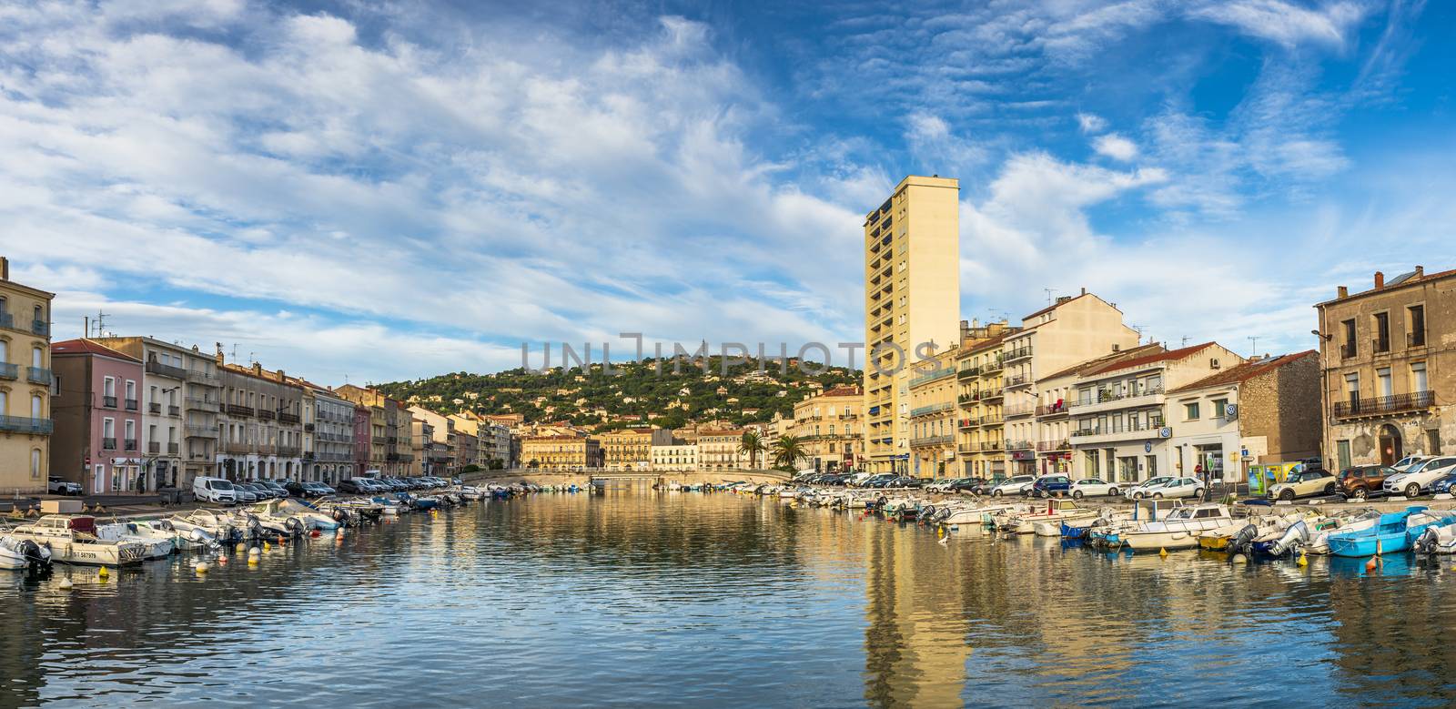 The panorama of the πeyrade canal in Sète, from the stone bridge, in Occitanie, France. by Frederic