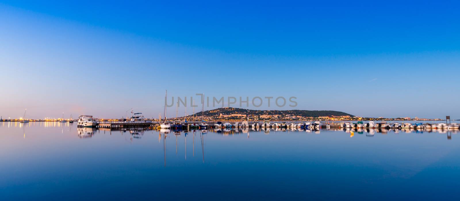 Panorama of the Thau lake at dawn and Mont Saint-Clair in the background. by Frederic