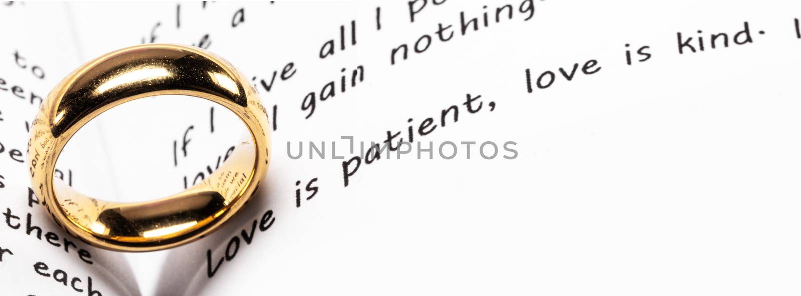 Golden wedding ring Love is Patient and Kind concept