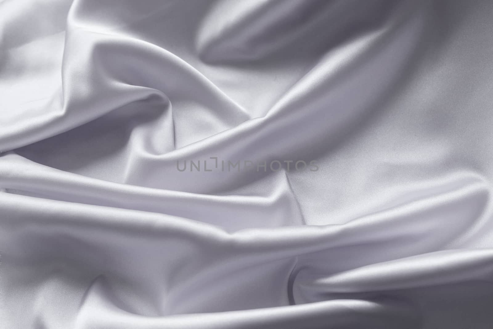 Smooth elegant gray silk with soft folds can be used as background.