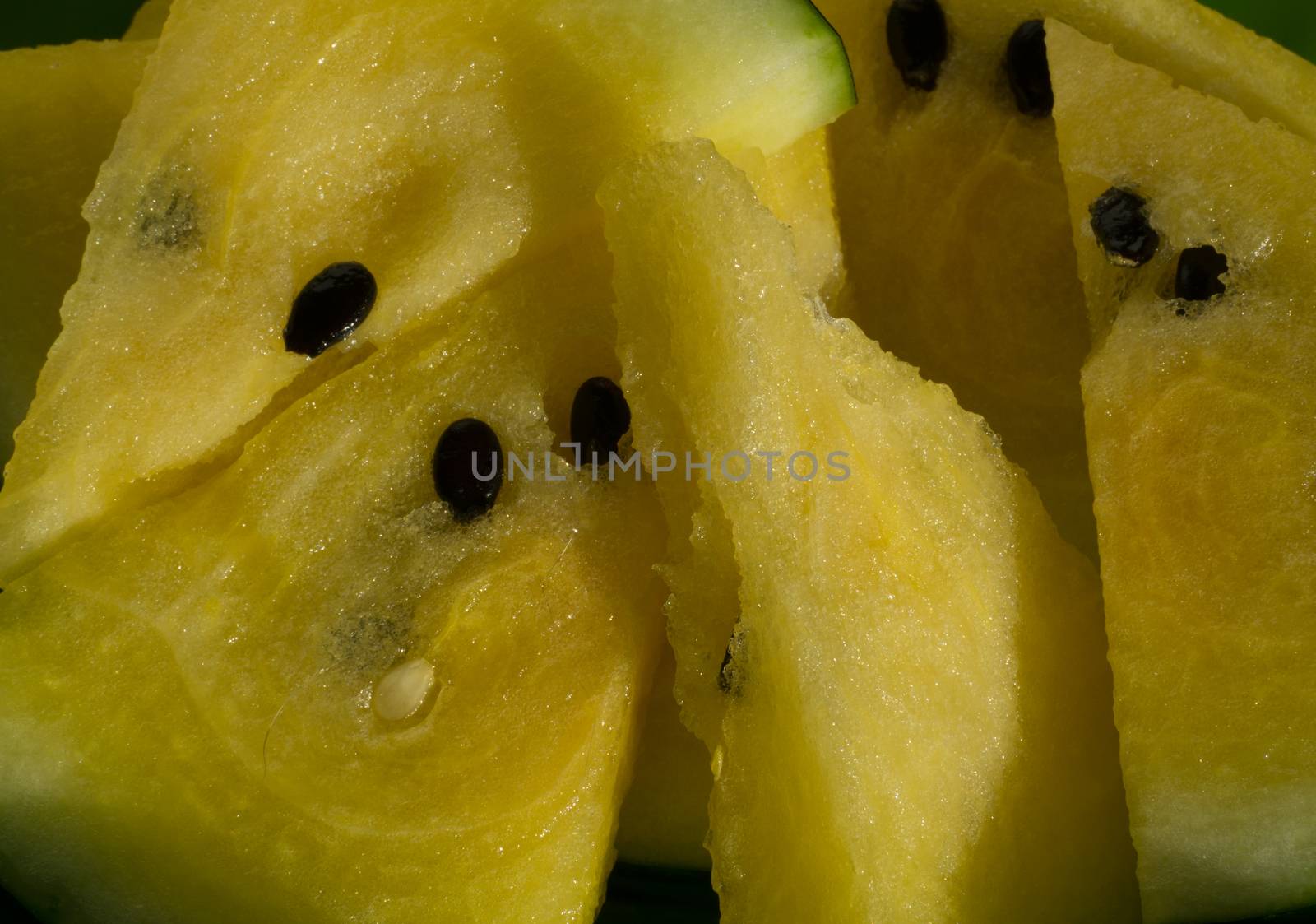 Yellow watermelon with slices and wedges for effective watermelon diet