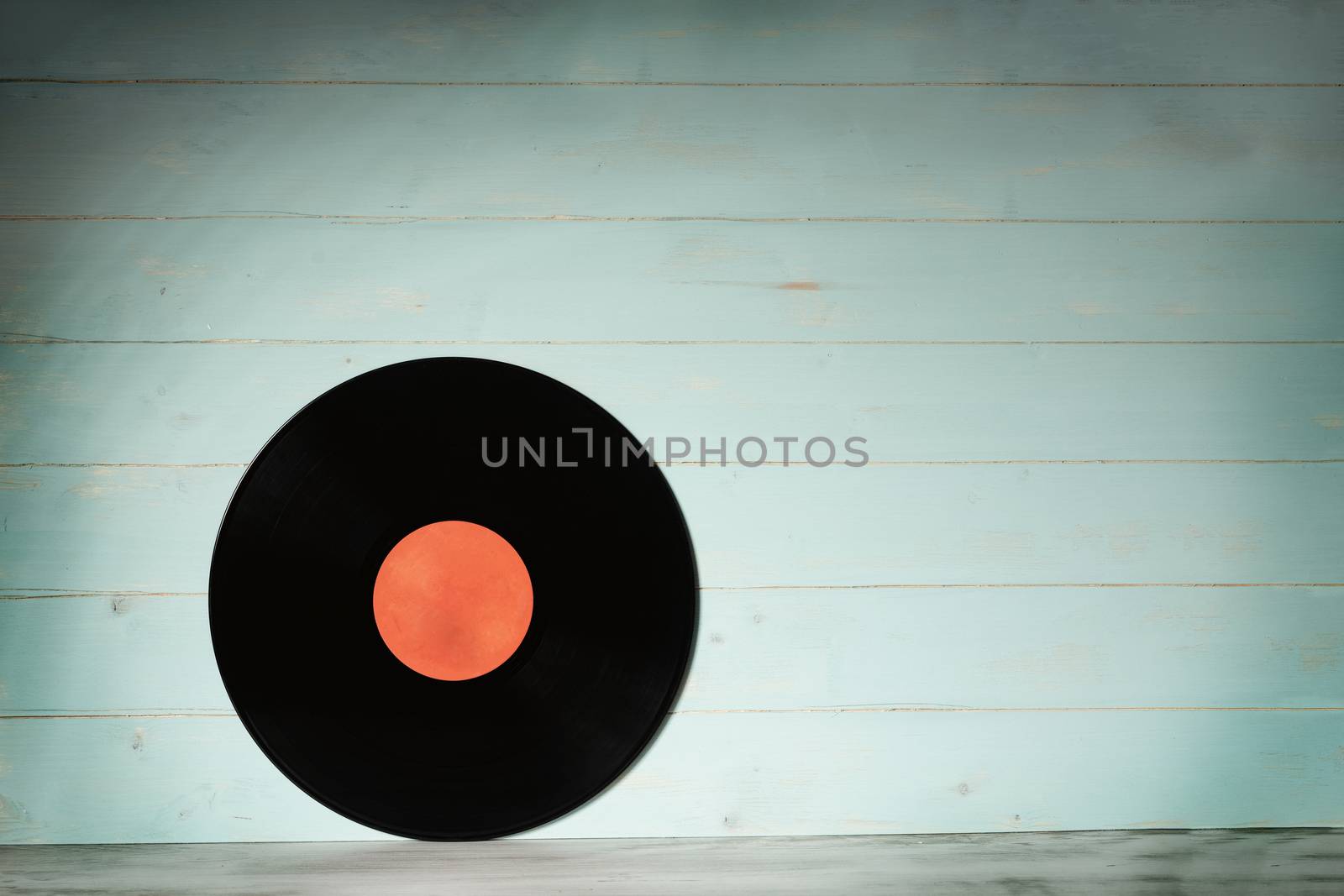 Vinyl record on vintage wooden background by Robertobinetti70