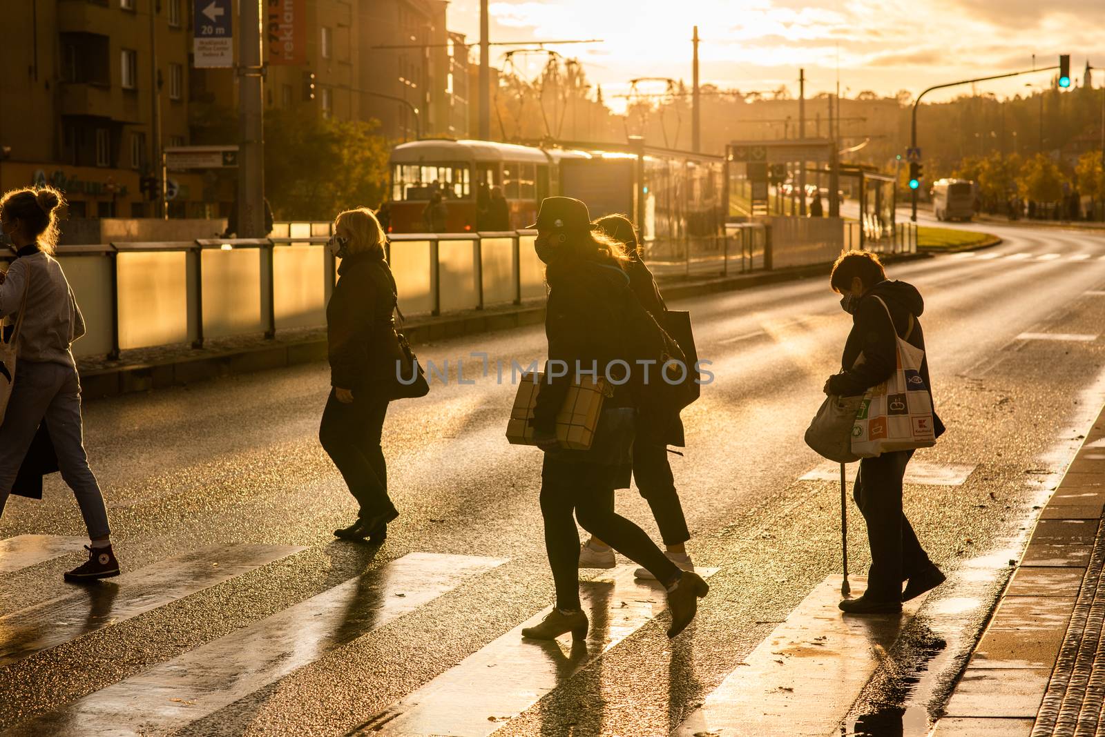 20/10/2020. Prague, Czech Republic. People with mask is crossing the street at Hradcanska metro station during quarantine period due to outbreak of COVID-19 as winter is starting. Prague, Czech Republic by gonzalobell