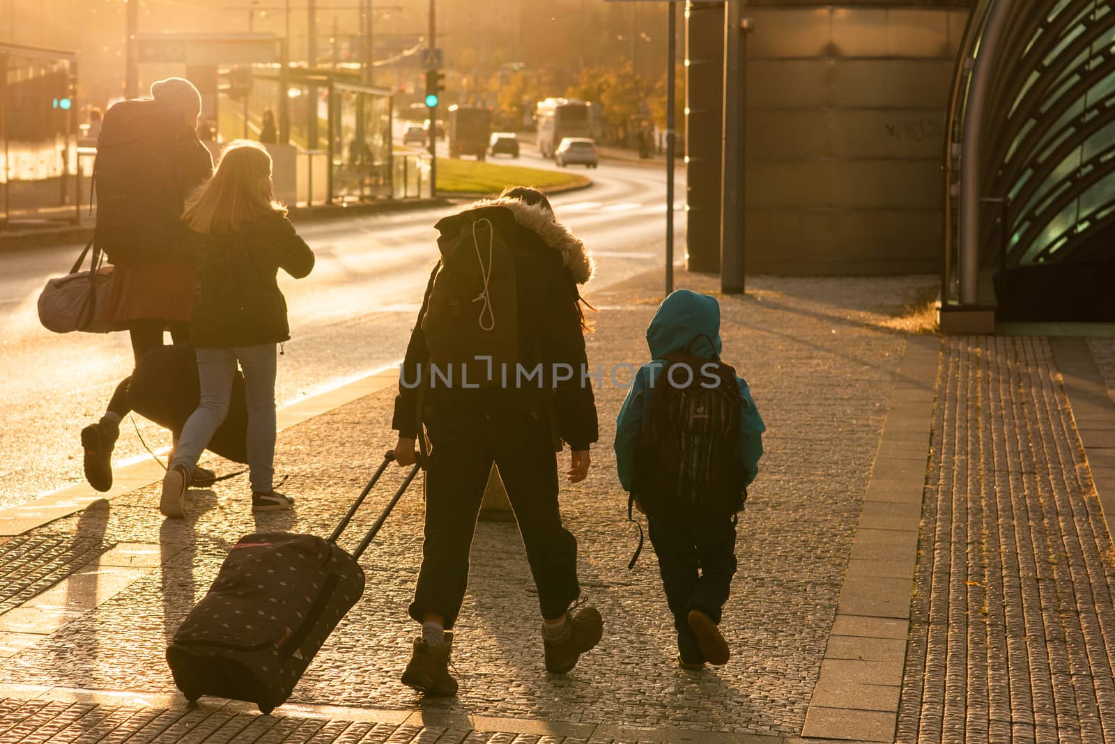03/04/2018. Brno, Czech Republic. Family with mask is crossing the street at Hradcanska metro station during quarantine period due to outbreak of COVID-19 as winter is starting. Prague, Czech Republic by gonzalobell