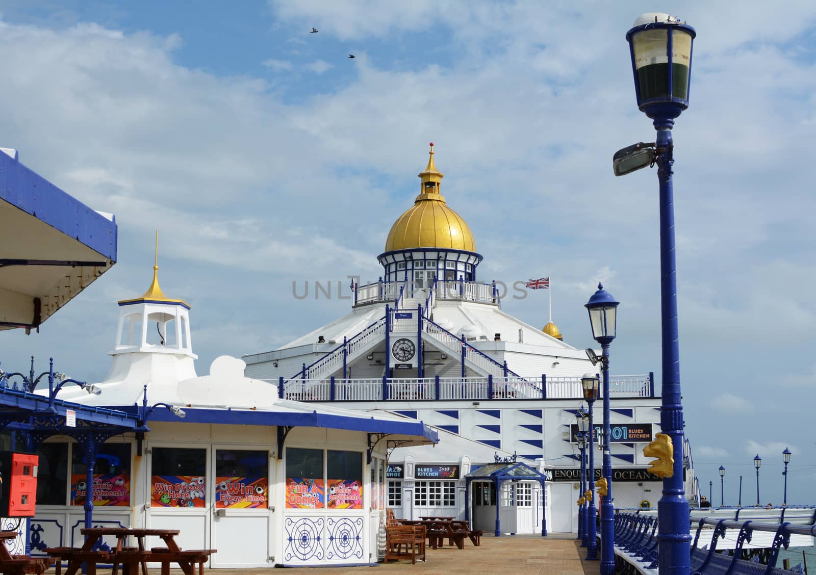 Open deck of Eastbourne pier with seating and arcade entertainme by sarahdoow