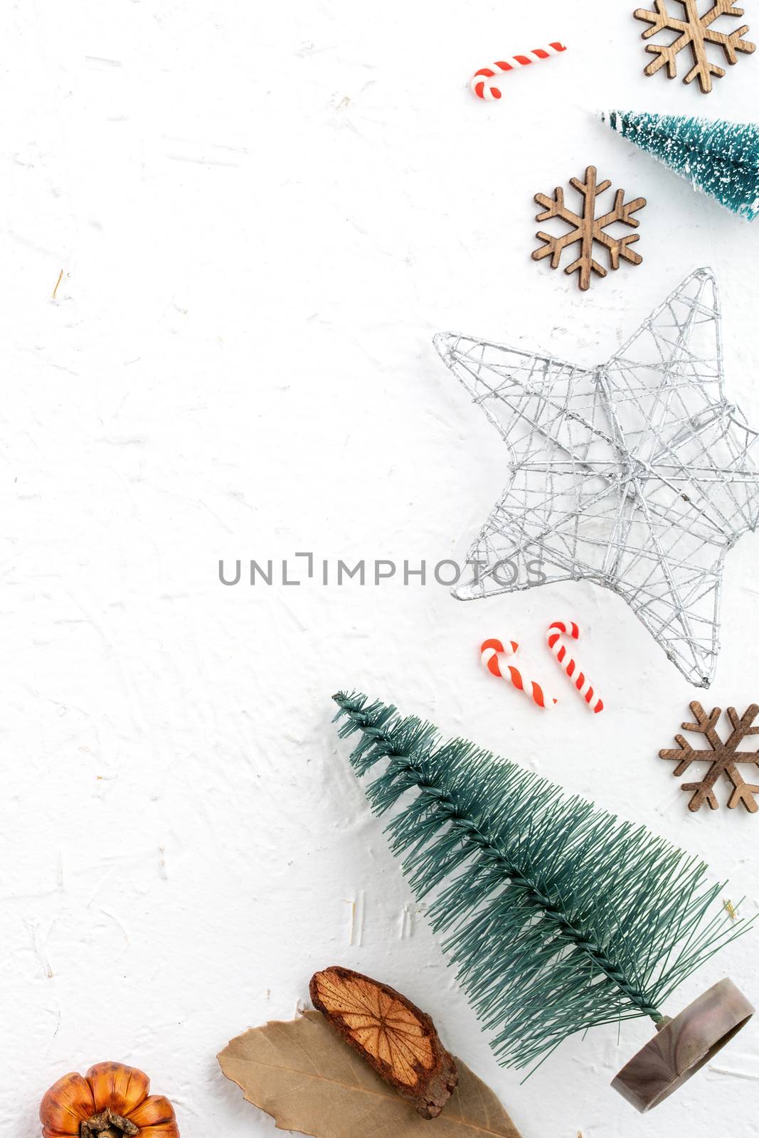 Top view of Christmas holiday decoration ornament composition with Christmas tree, gift star, gingerbread man flat lay with copy space isolated on white background.