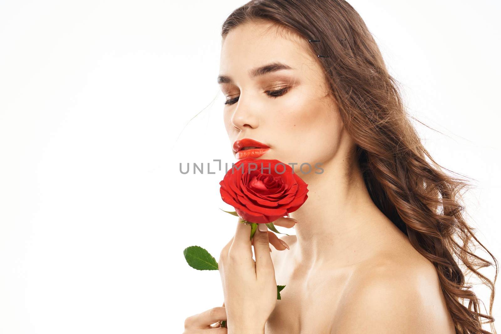 Woman with naked shoulders and red rose evening makeup light background by SHOTPRIME