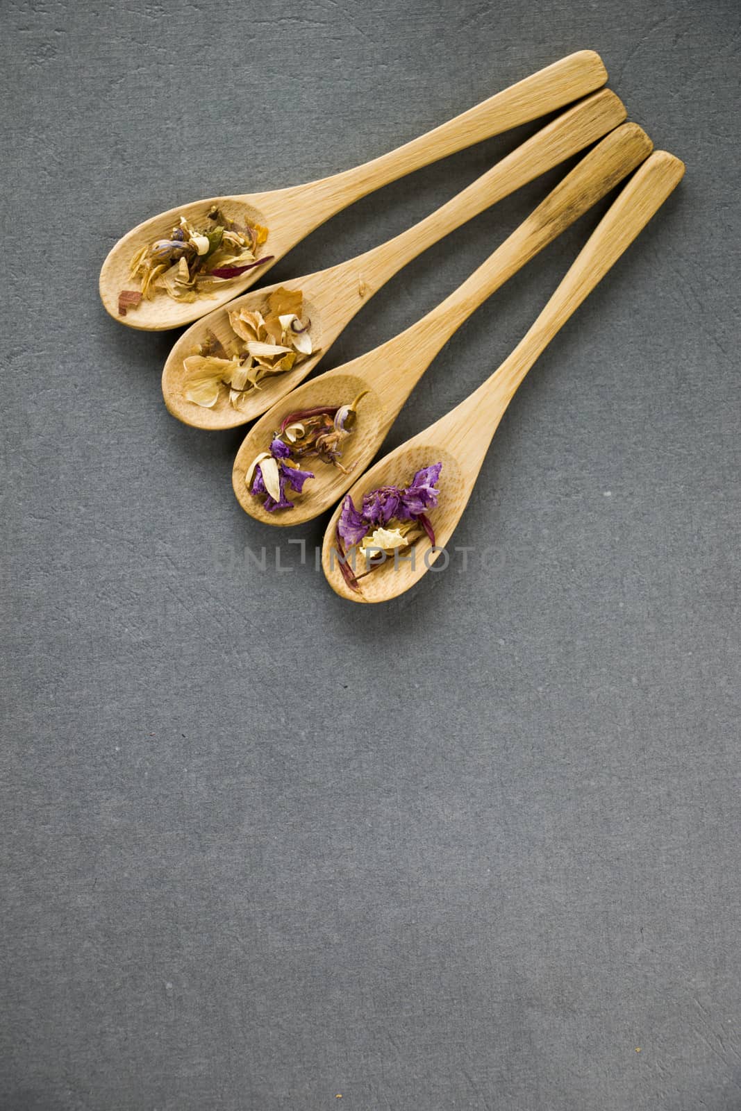 Herbal and natural dry tea set, variation and collection of tea and wooden spoons by Taidundua