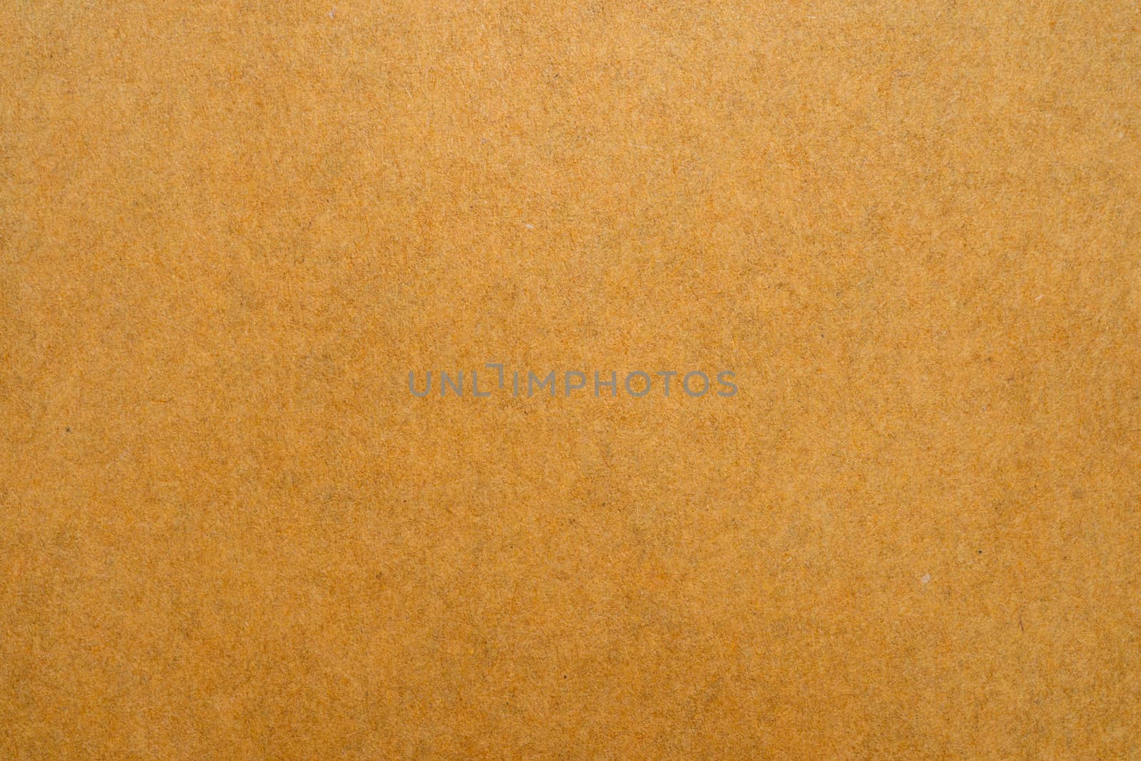 Close up of brown envelope texture on white background.