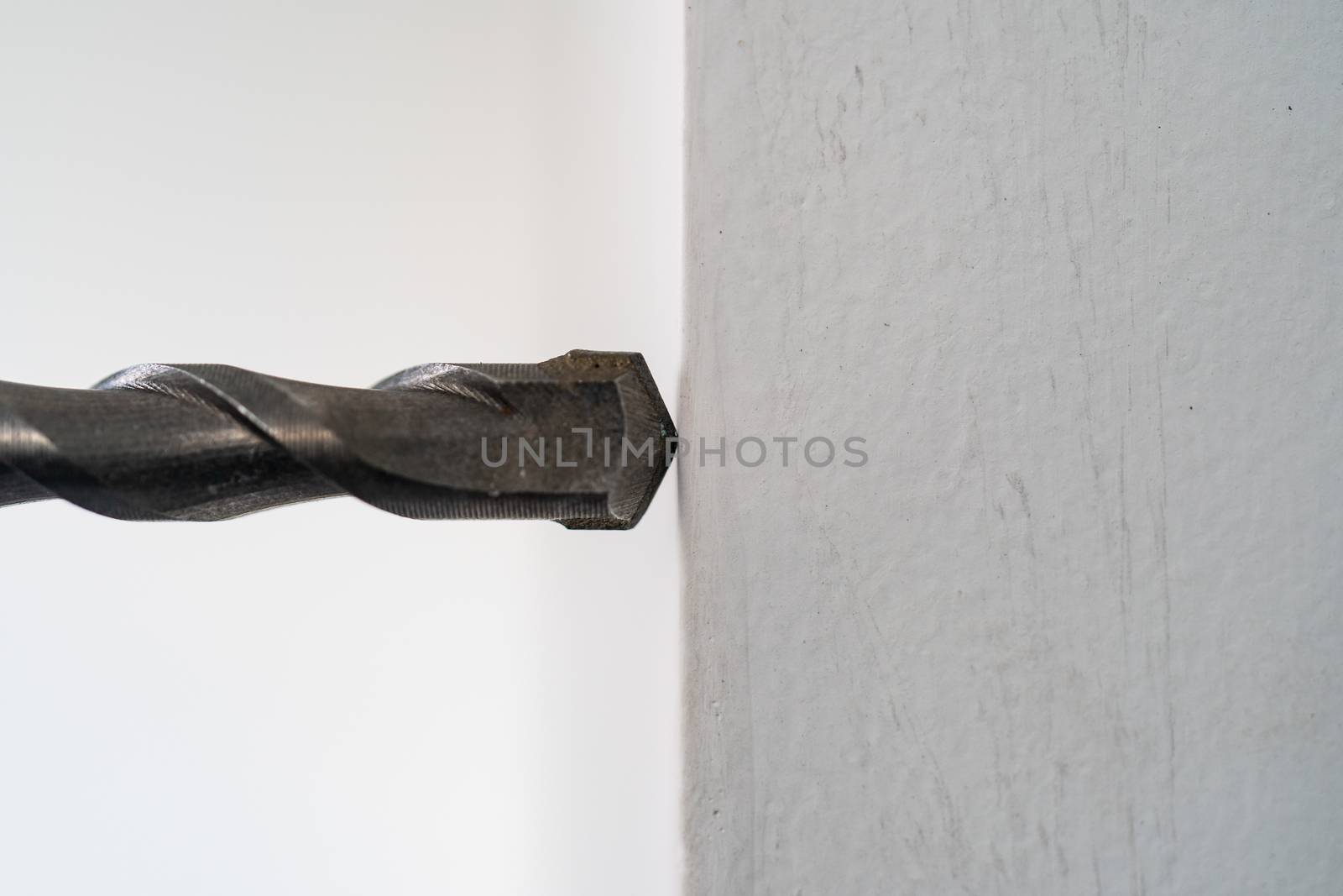 close-up of drilling machinery. Worker use drilling machine to make holes in concrete walls.