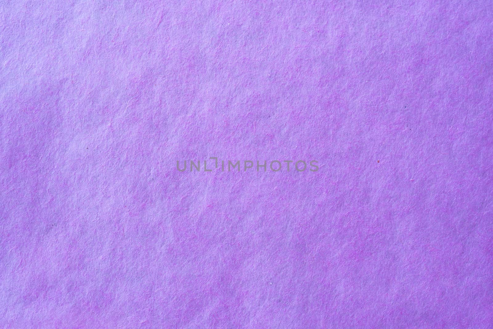Purple crumpled paper texture background.