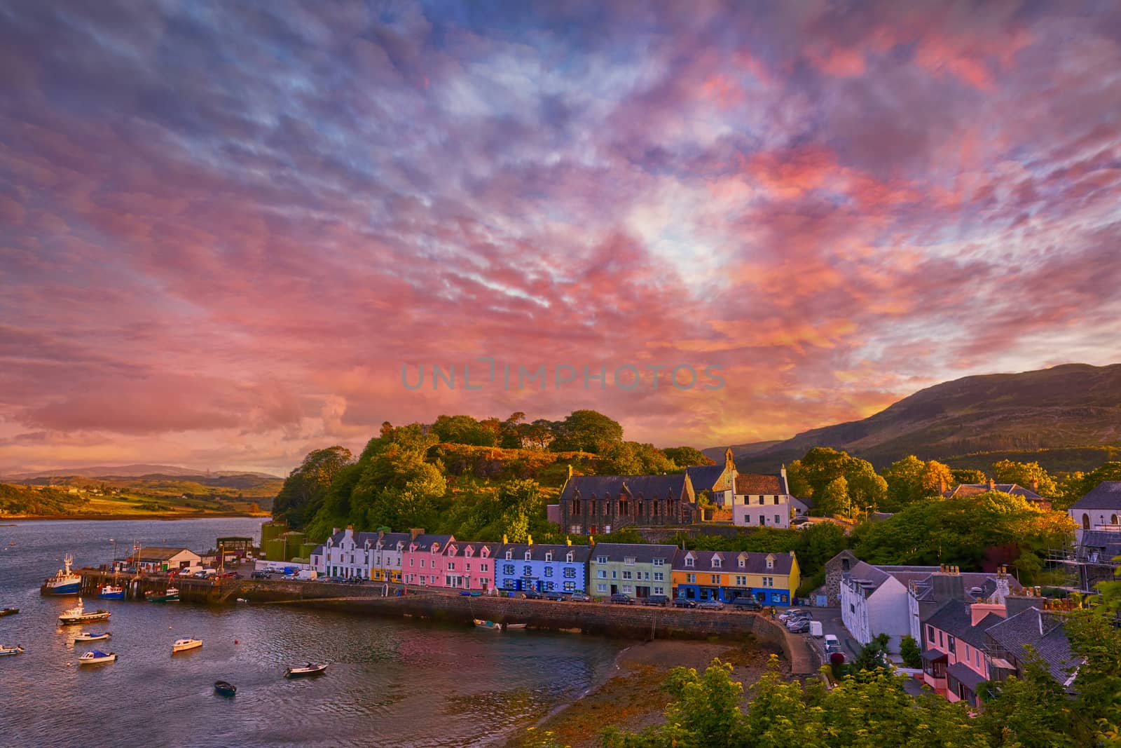 sunset over famous Quay street in Portree, Isle of Skye, Scotland