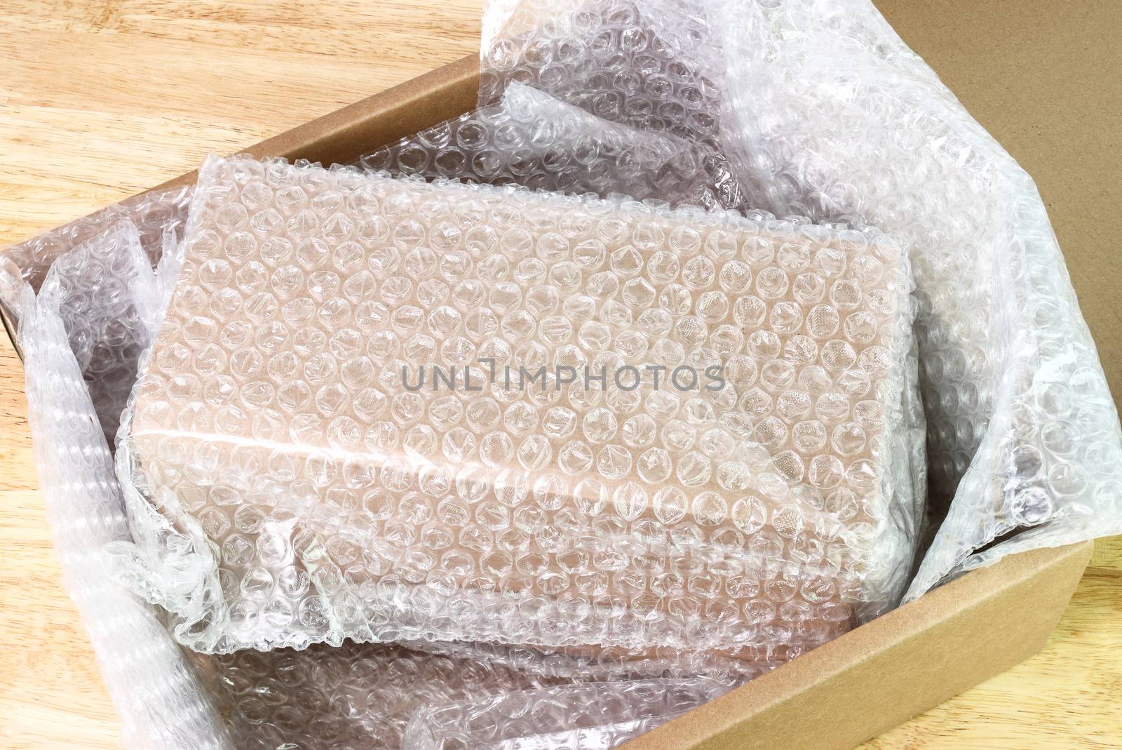 Bubbles covering the box by bubble wrap for protection product cracked  or insurance During transit 