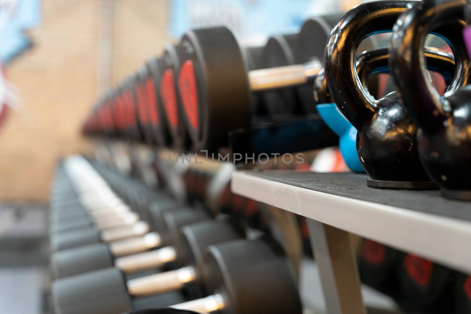 Set of dumbbell for exercise and strength training. sport, fitness, health, lifestyle and people concept by mikesaran