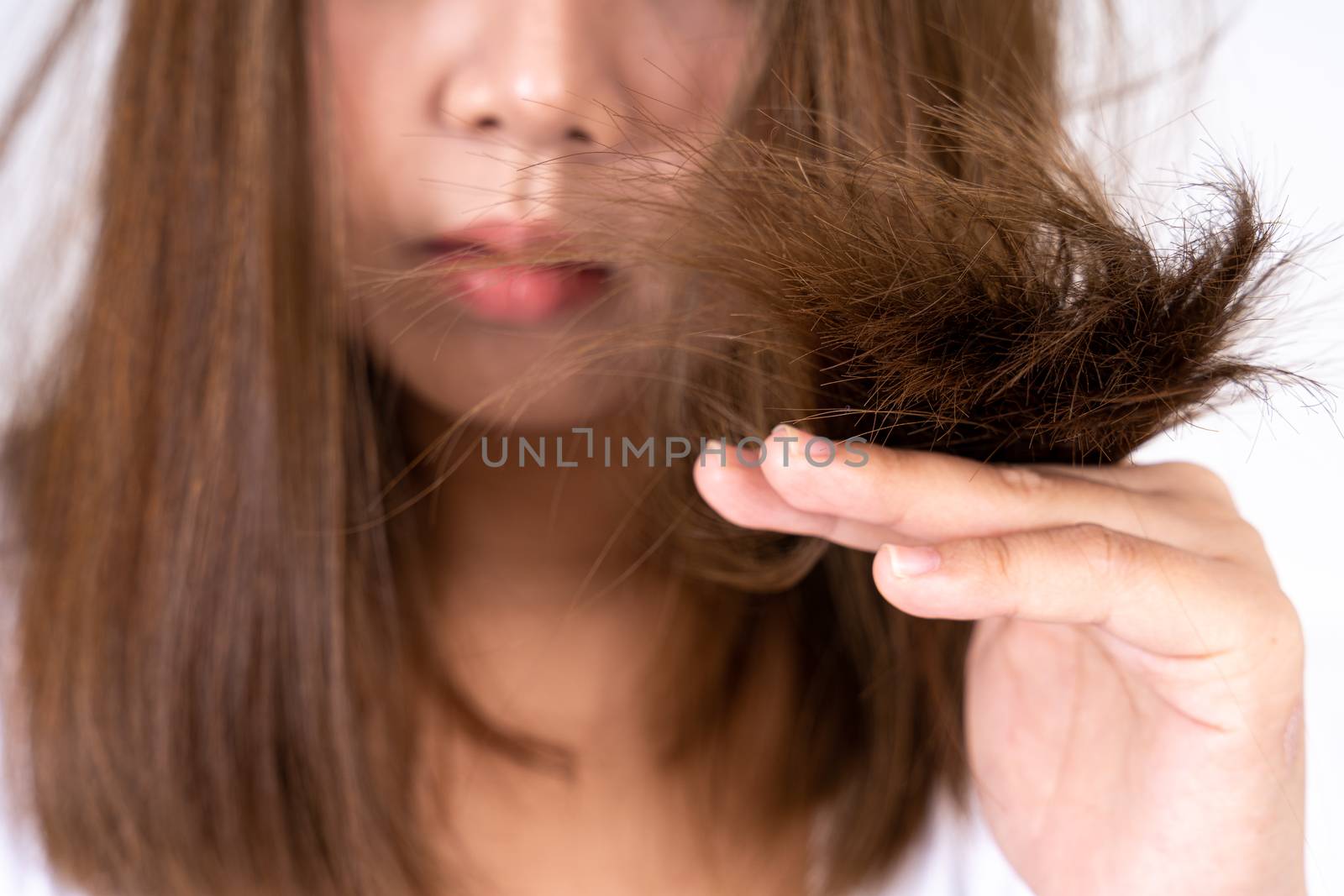 Hair fall problem, closeup hand holding problem hair. Healthcare medical or daily life concept. by mikesaran