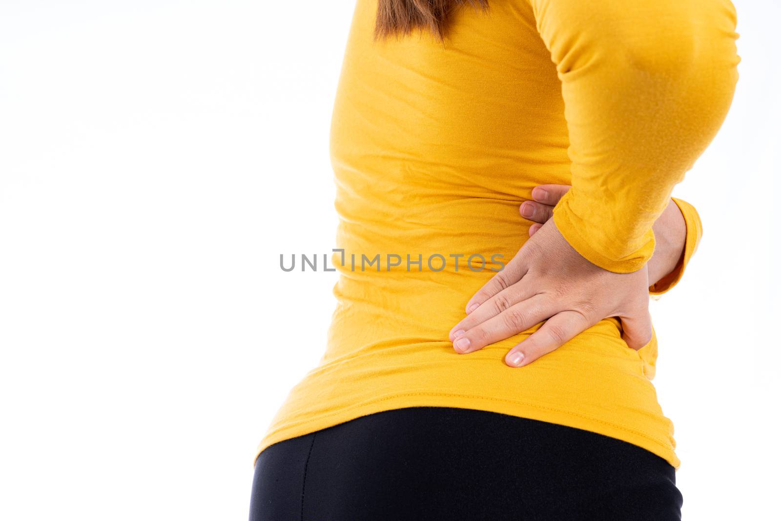Woman suffering from waist and back pain isolated white background. Health care and medical concept.