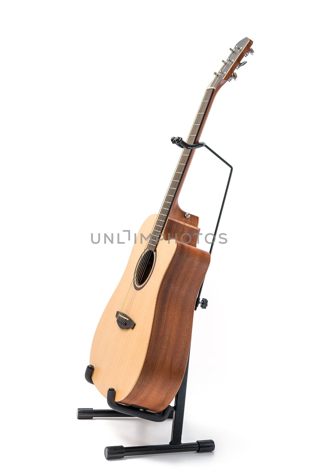 acoustic guitar with stand isolated on white background