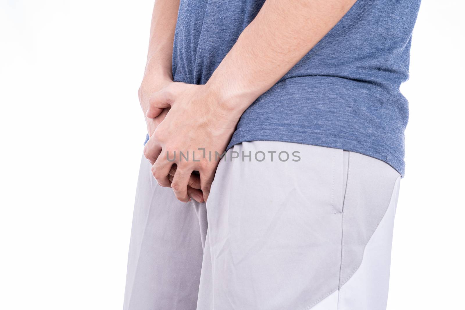 Man hands holding his crotch isolated white background. Medical, healthcare for advertising concept.