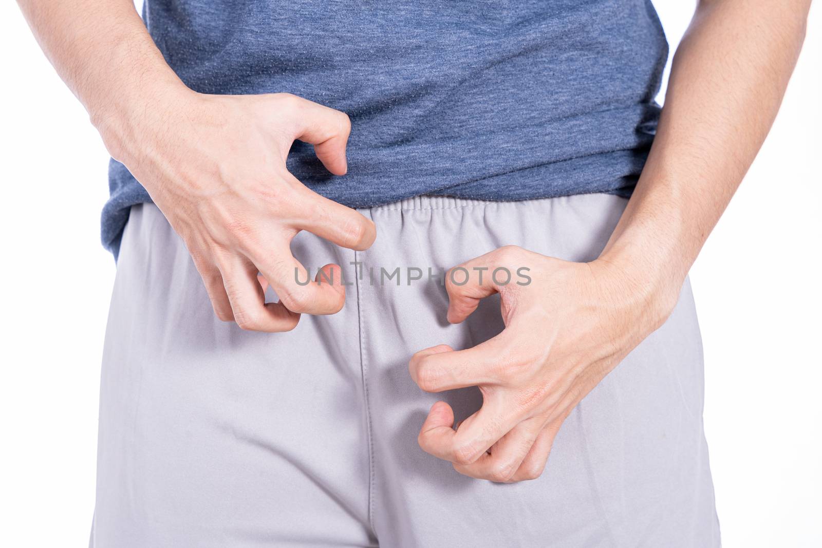 Man hands scratching his crotch isolated white background. Medical, healthcare for advertising concept.