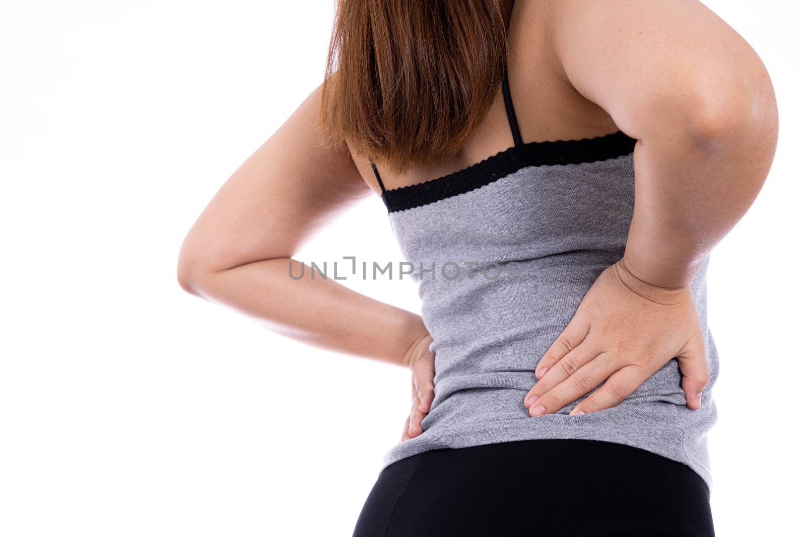 Woman suffering from waist and back pain isolated white background. Health care and medical concept.