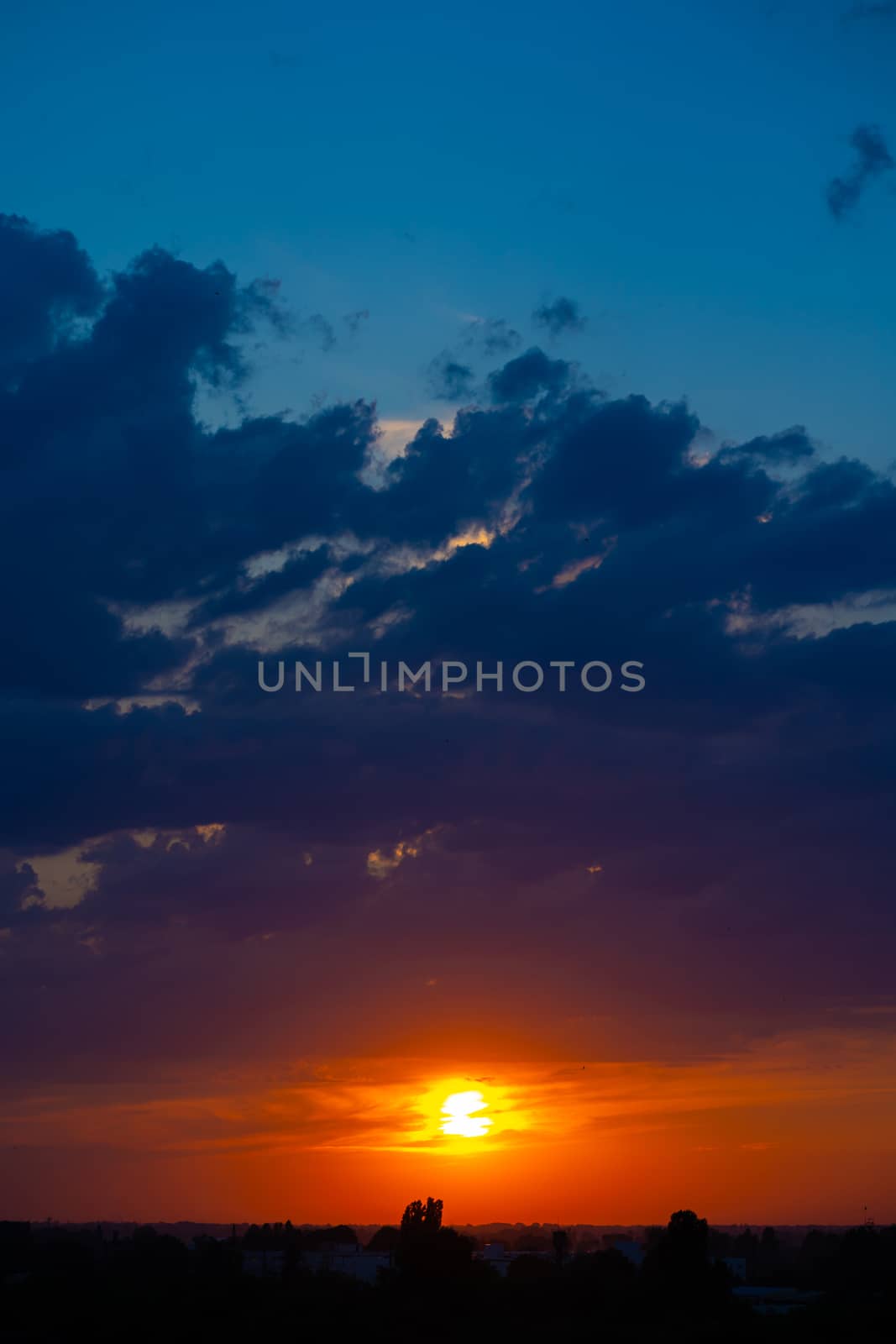 Heavy cloudy sky at sunset. A landscape of beautiful nature.