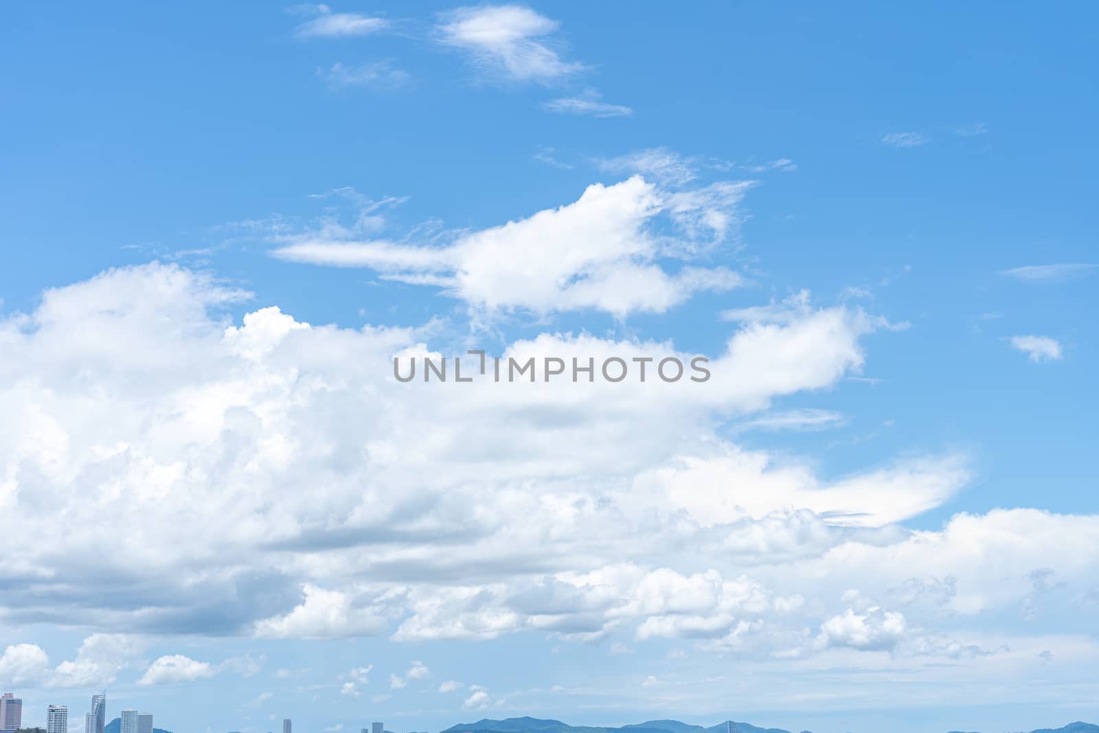 Clear blue sky with white cloud background in the morning. Good weather background. by mikesaran