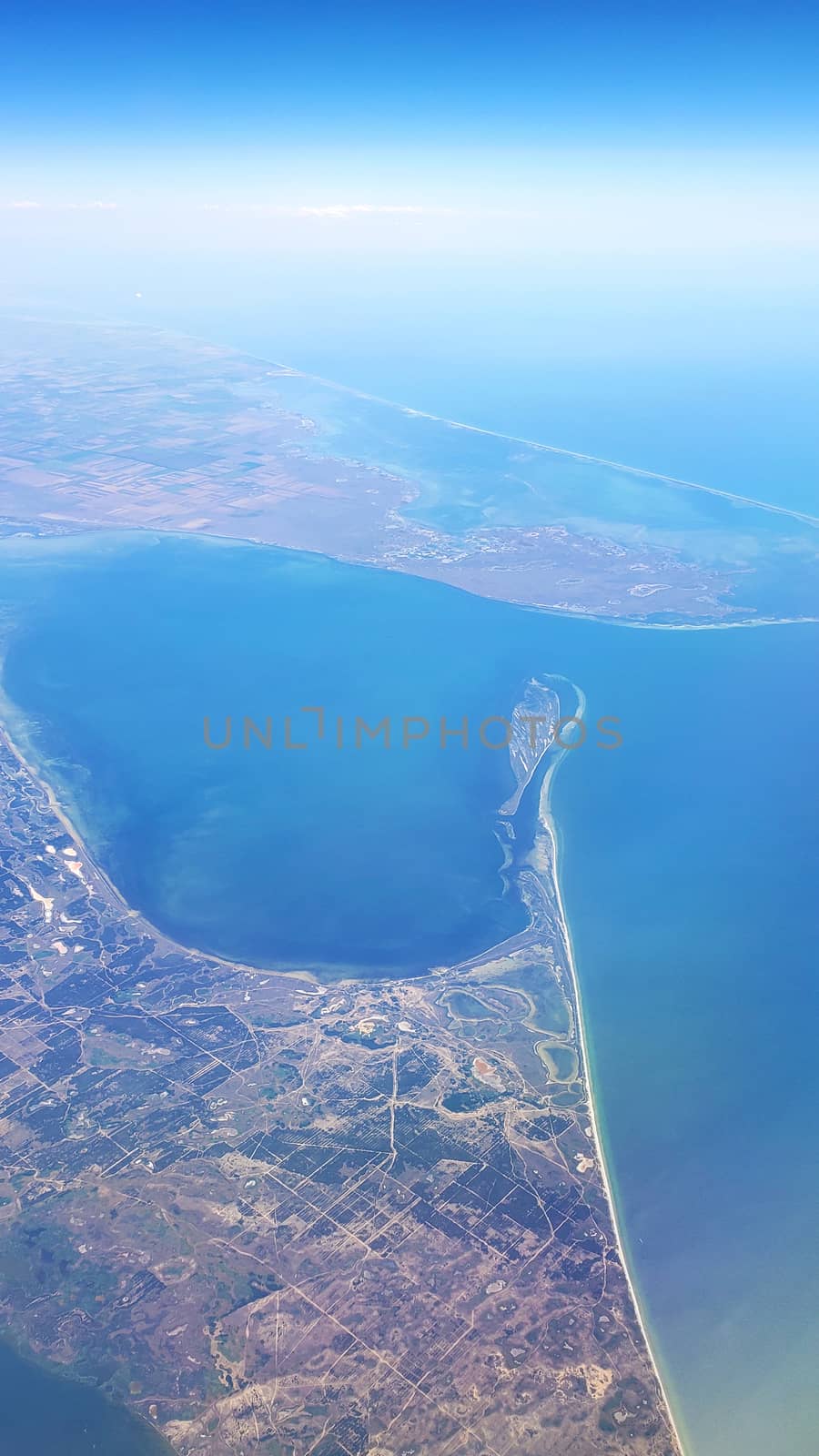 The view from the airplane window to the ground. Landscape view from the sky.