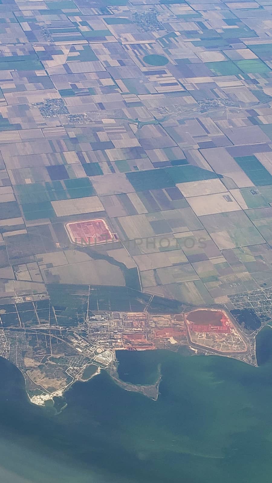 The view from the airplane window to the ground. Landscape view from the sky.