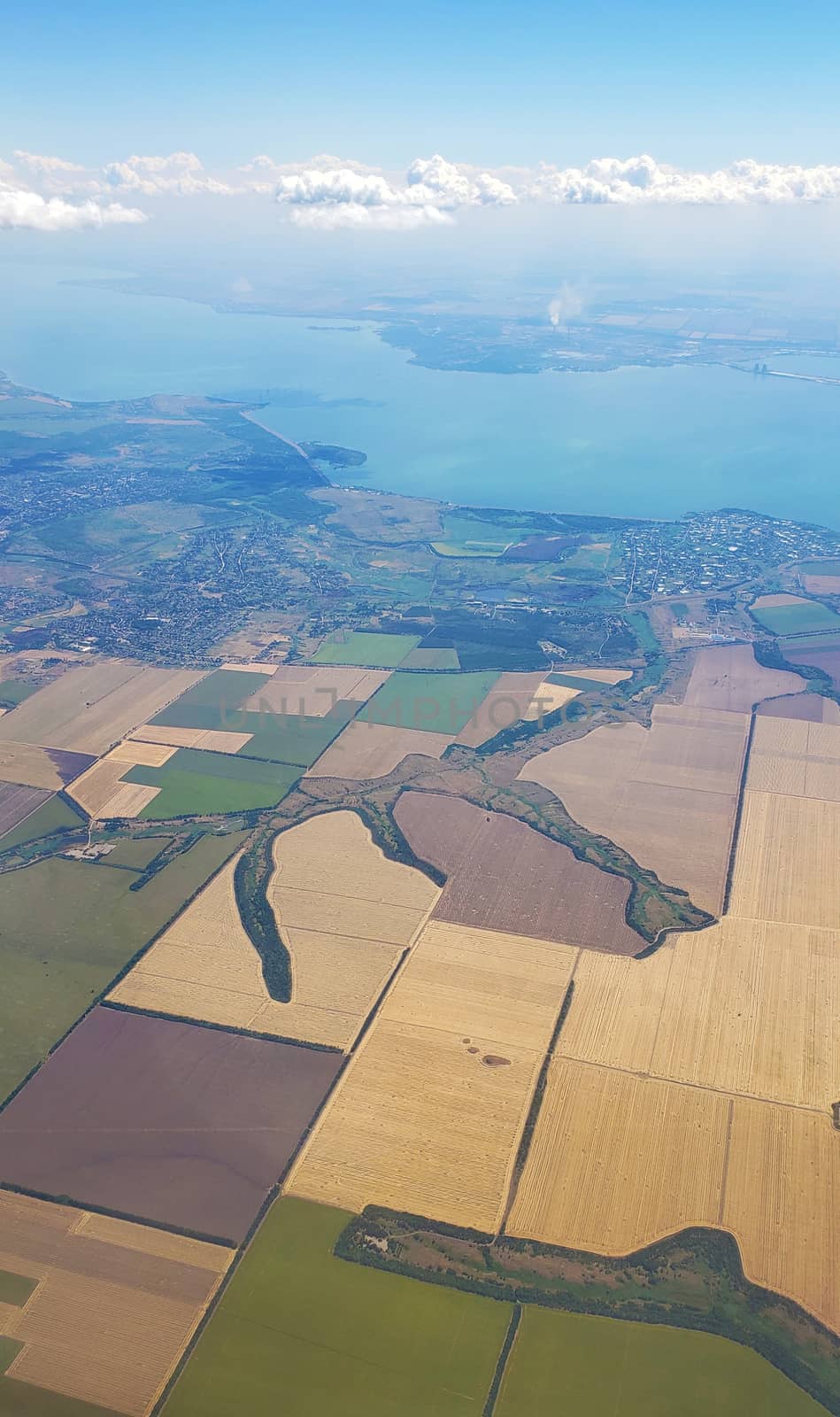 The view from the airplane window to the ground. Landscape view from the sky.