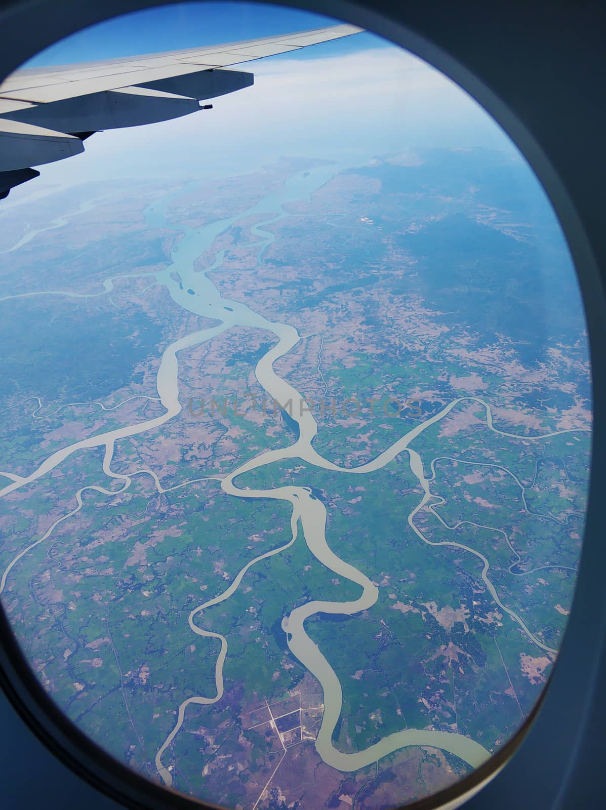 The view from the airplane window to the ground. Landscape view from the sky.