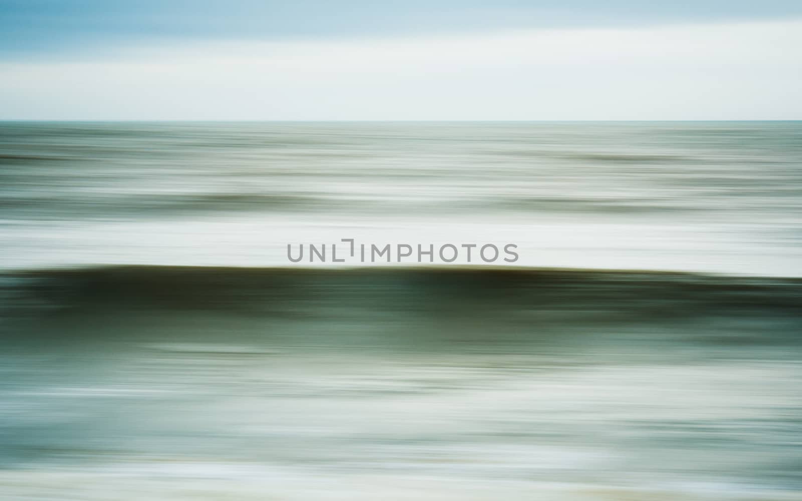 Intentional camera movement of ocean wave, dreamy seascape