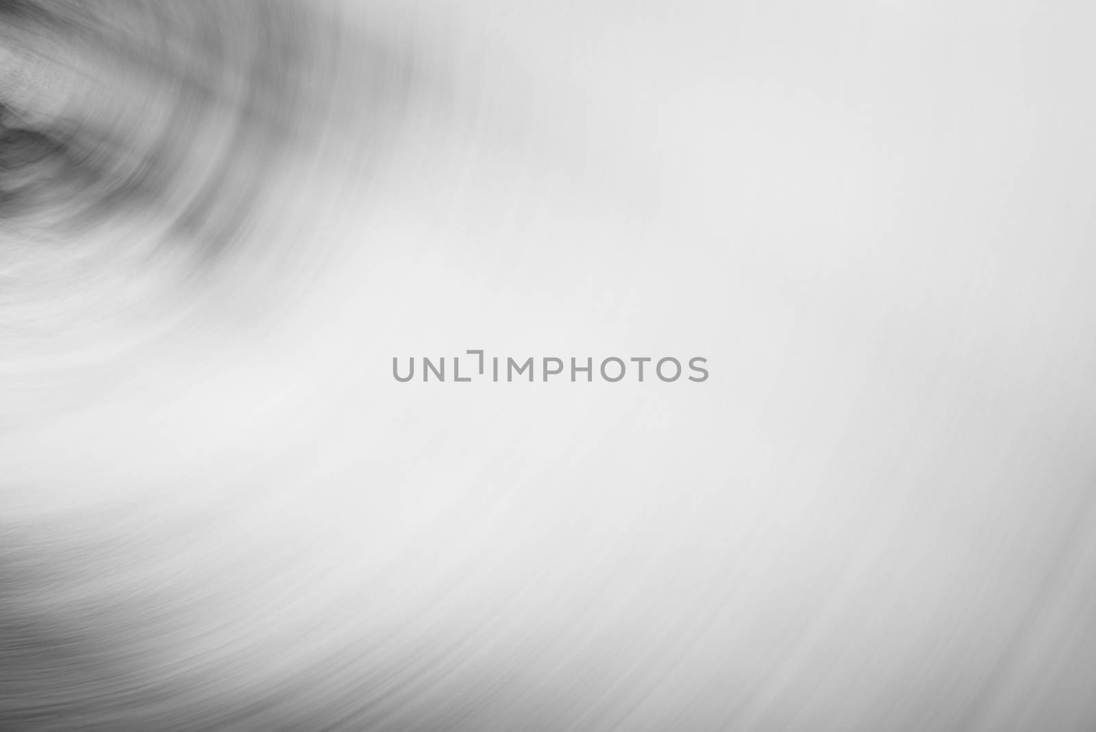 Abstract black and white background, motion blur with circular movement