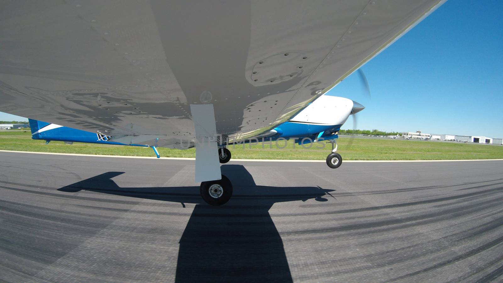 Views of a general aviation aircraft performing maneuvers on the ground and in the air