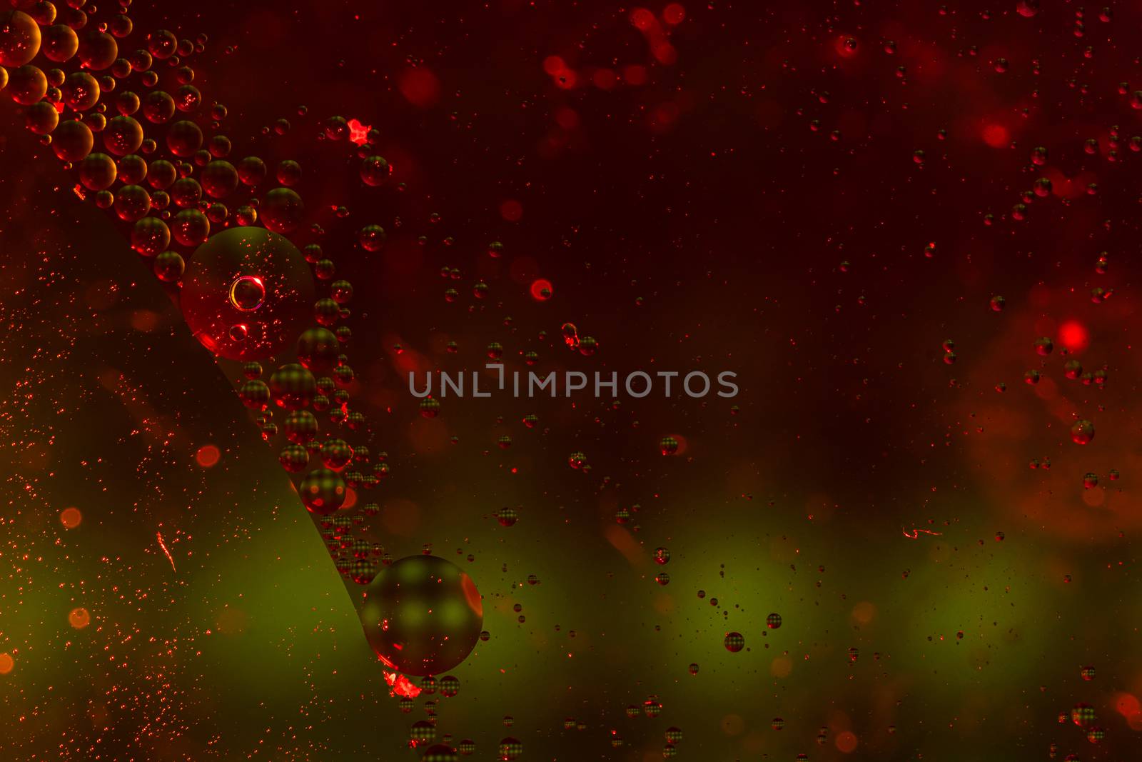 Abstract colorful backdrop with oil drops and waves on water sur by vladispas