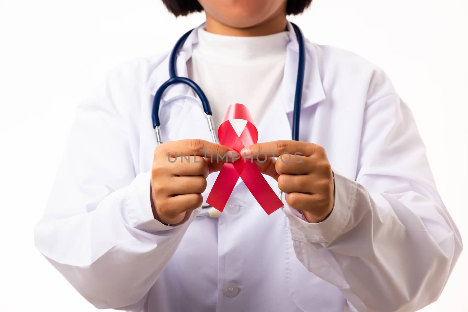 Woman medical doctors in uniform holding support HIV AIDS awareness red ribbon on hands in studio shot isolated on over white background, Healthcare and medicine, World aids day concept
