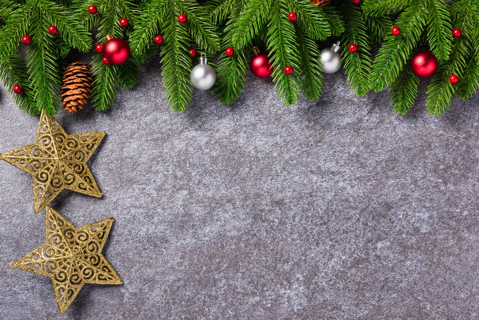 Christmas border decorations holiday, Top view from above green fir tree branches with Xmas ornament baubles, the star on table concrete background, Happy new year concept