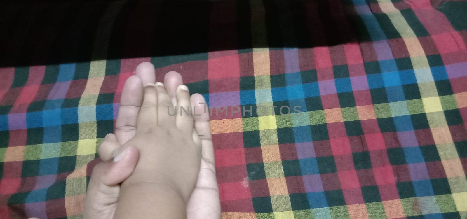 child and father hand closeup with trust