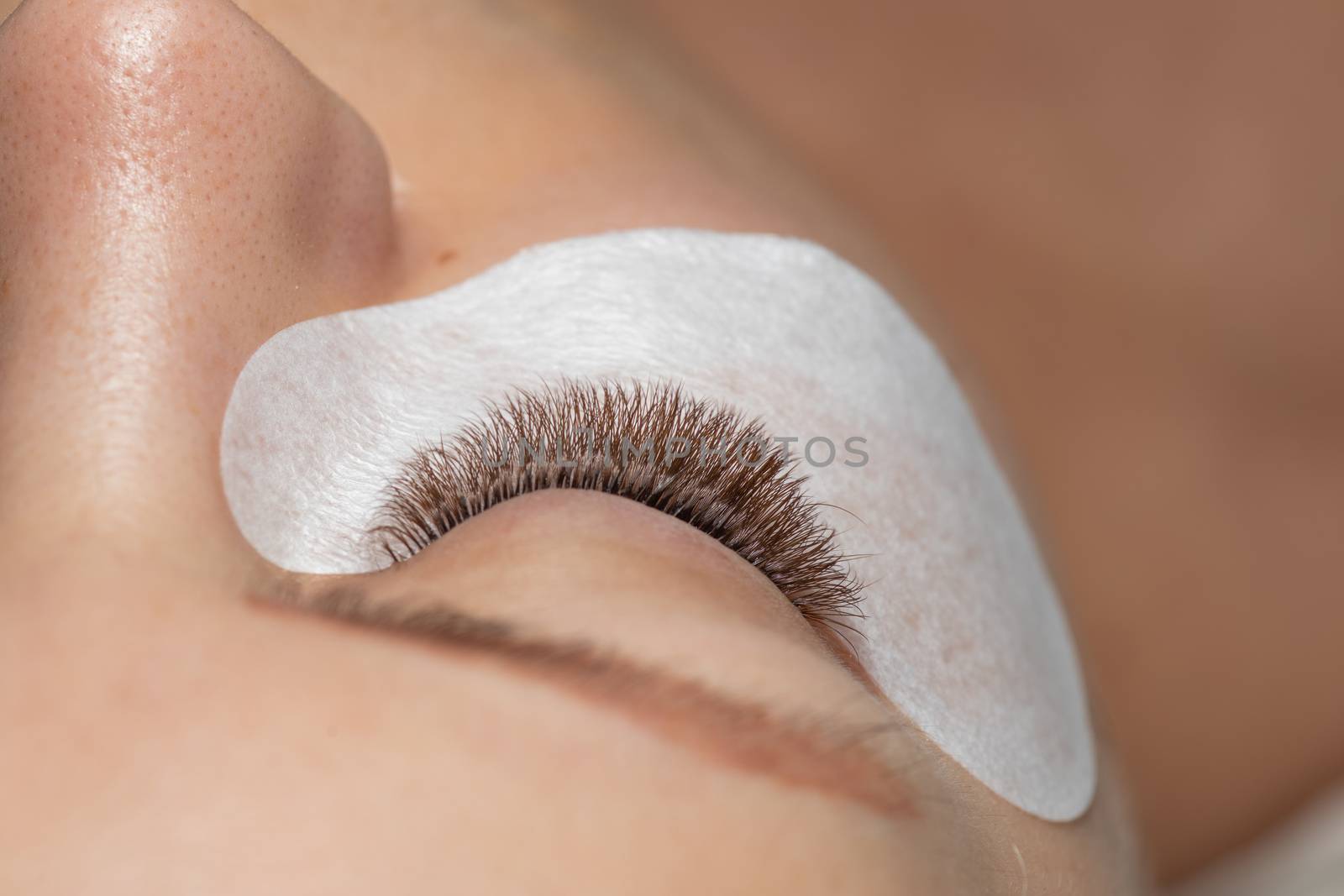 One Woman Eyes with Eyelashes Extension with eyepatch under eye  by adamr