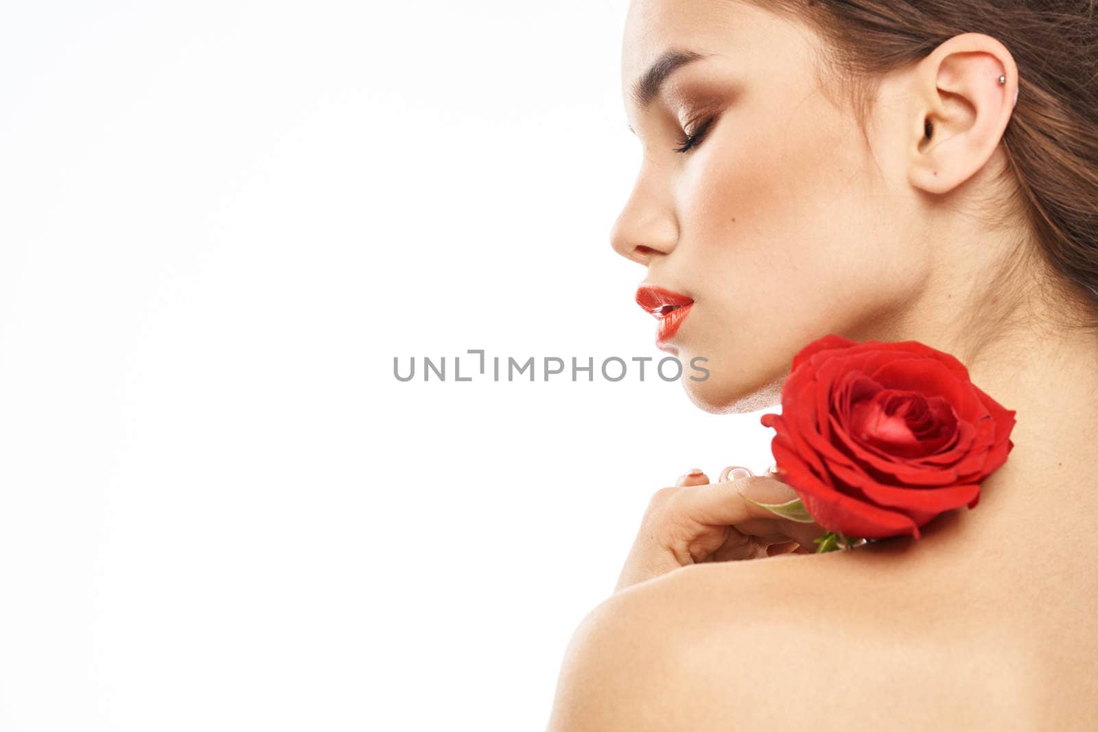 Portrait of woman with red rose naked shoulders Make-up on brunette face by SHOTPRIME