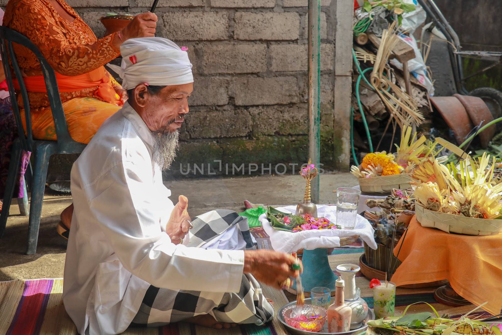 The Hindu Priest or widely known as Pedanda by the Balinese, blessing the ceremony of villas in Nuda dua,Bali by Sanatana2008
