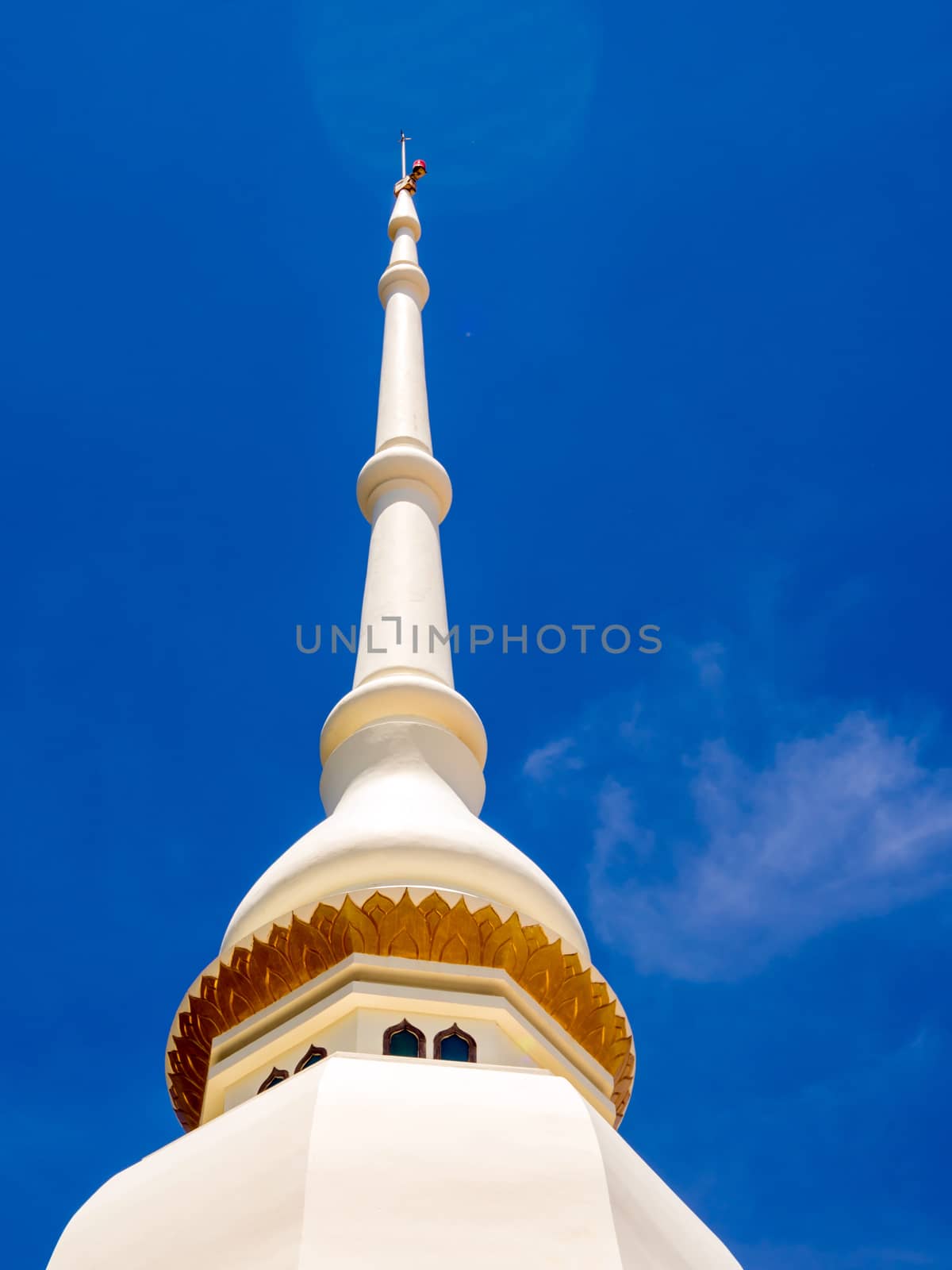 Gorgeous fine white pagoda in Buddhist temple and the bright blur sky