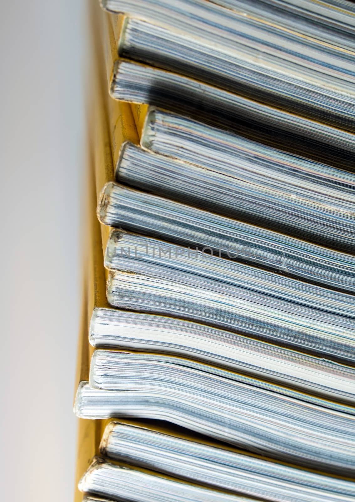 Stack of yellow color monthly magazine