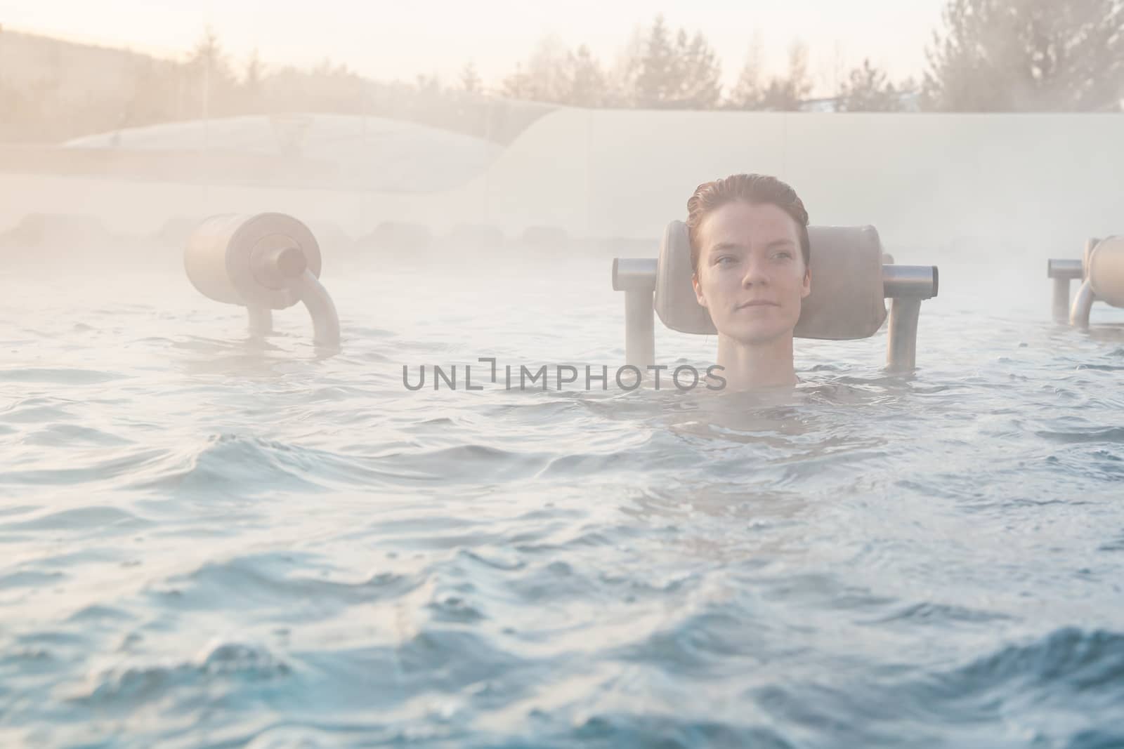 relax in termalnix spa, woman in swimming pool in winter by Edophoto