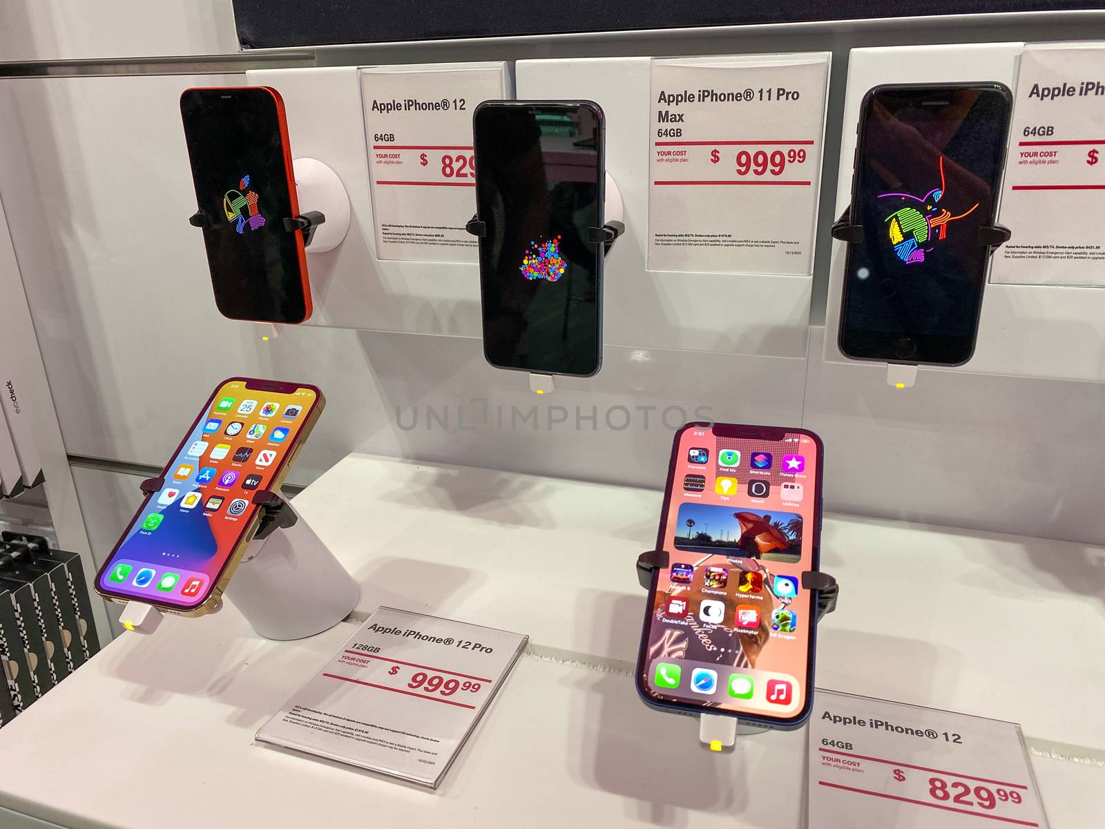 Orlando, FL/USA - 10/25/20: The new Apple iPhone 12 and 12 Pro on display at the T Mobile store.